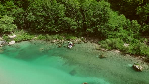Aerial view of a group doing water rafting on the rapids at Soca River.