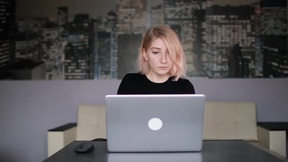 Businesswoman Using Laptop at Home