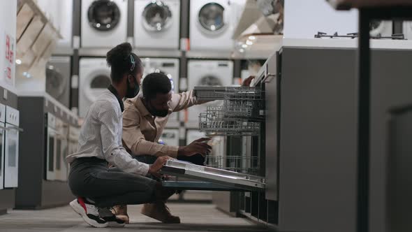 Two Persons with Face Masks are Shopping in Hardware Store at Pandemic of Covid19 Black Spouses are