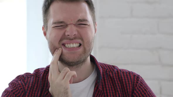 Toothache Young Man with Tooth Pain in Gums