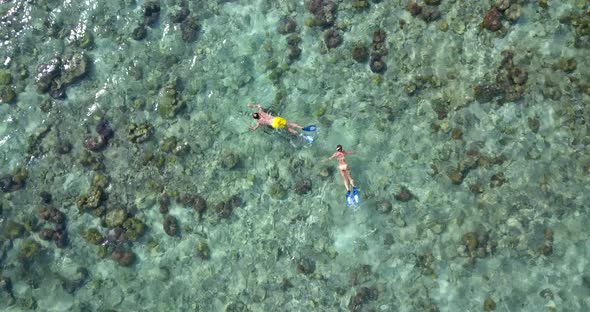 Young man and woman on romantic honeymoon live the dream on beach on white sand background 4K