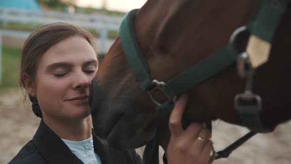 Horsewoman Touching Her Face To Her Seal Brown Horse  Love For Horses