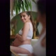 A Pregnant Girl Looks at Her Belly in the Mirror - VideoHive Item for Sale