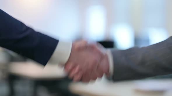 Close Up of Two Businessmen Shaking Hands