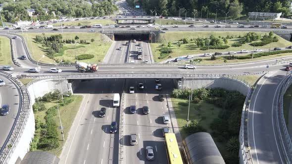 Cars Ride on the Road. Slow Motion. Kyiv. Ukraine. Aerial