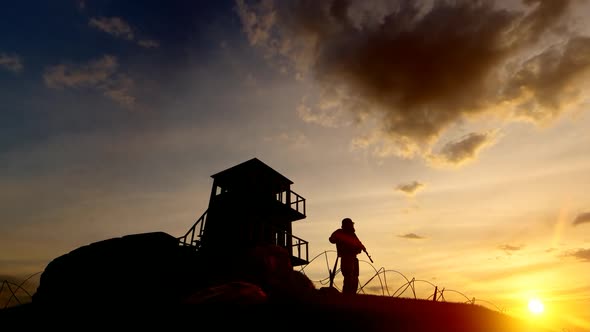 Soldier Watching the Military Watchtower and Sunset View