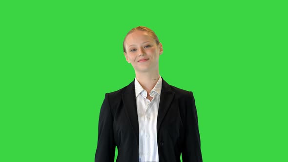 Attractive Blonde Business Woman Walking on a Green Screen Chroma Key