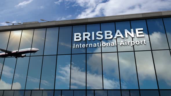 Airplane landing at Brisbane Australia airport mirrored in terminal