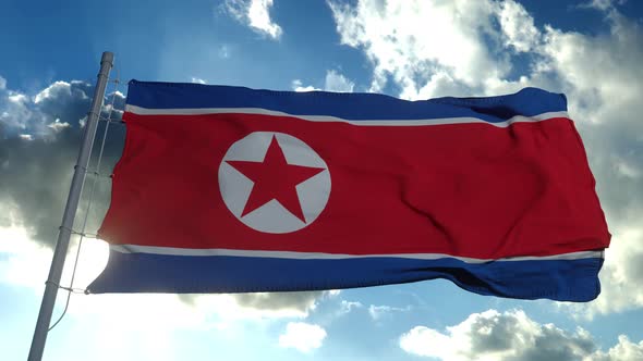 North Korea Flag Waving in the Wind Against Deep Blue Sky
