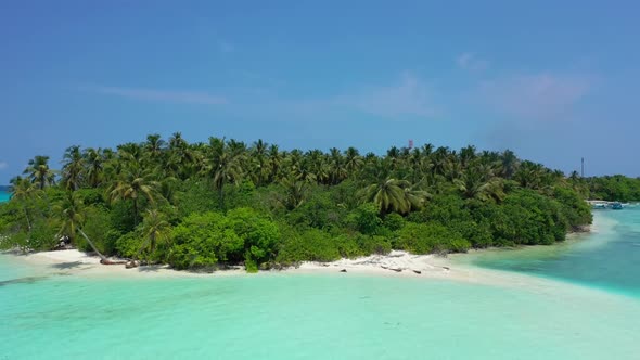 Aerial flying over sky of idyllic lagoon beach lifestyle by blue lagoon with bright sand background 