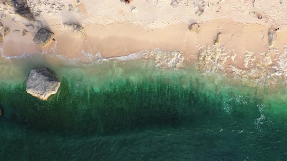 Aerial View Azure Calm Ocean Waves Splashing Along the Sandy Beach