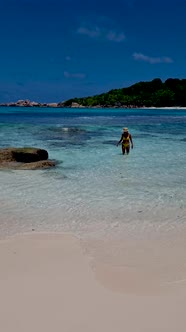 Anse Source d'Argent La Digue Seychelles Young Women on a Tropical Beach During a Luxury Vacation in