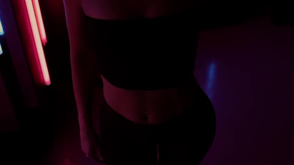 Sensual Woman Under Neon Illumination