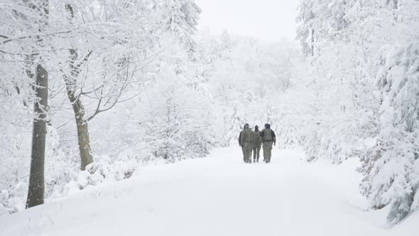 Group of Soldiers in Winter Forest