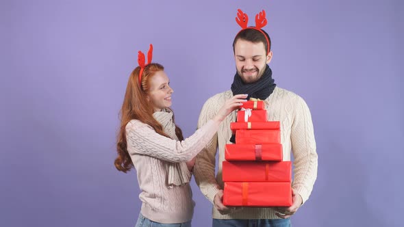 Loving Pretty Couple Posing in Studio at Camera