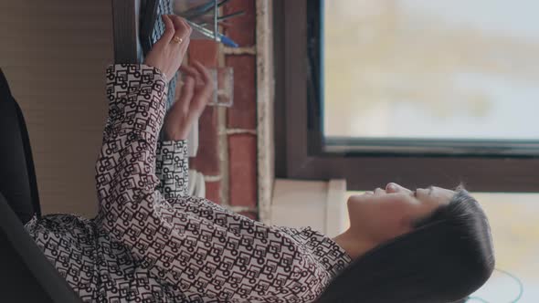 Vertical Video Asian Woman Using Computer to Plan Business Strategy