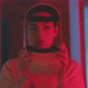 Young woman holding vr goggles looking into the camera in red neon light - VideoHive Item for Sale