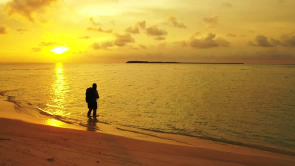 Tourist posing on beautiful resort beach break by transparent sea with white sand background of the 