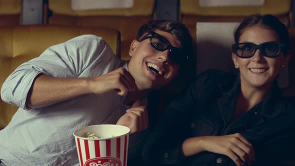 Man and Woman in the Cinema Watching a 3D Movie