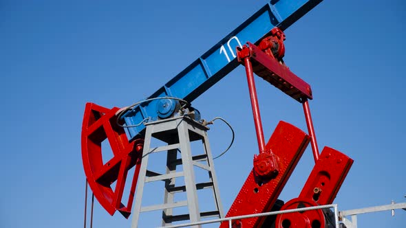 Oil Rig Stands in a Field at and Extracts Minerals