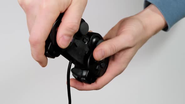 Hand holding joystick and play on white background. HD