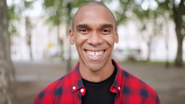 Smiling bald African man looking at the camera