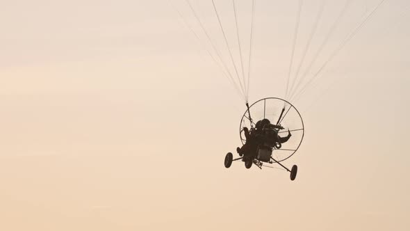 Tandem Paramotor Gliding - Two Men Flying and Gliding in the Air