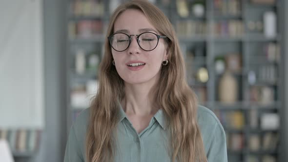 Portrait of Tired Woman Yawning in Office