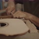 Luthier cutting cracks in a guitar mold - VideoHive Item for Sale