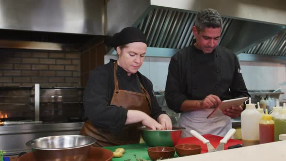 Caucasian man and woman cooking