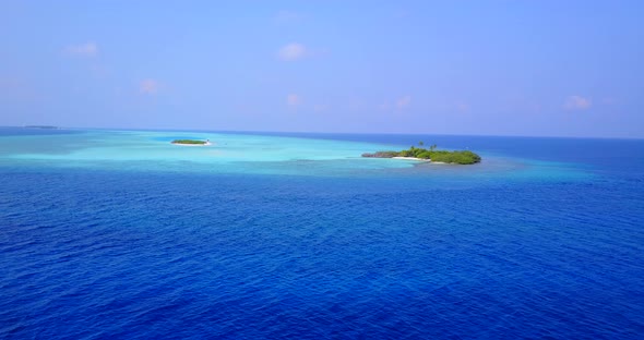 Beautiful drone copy space shot of a white sand paradise beach and aqua blue water background 