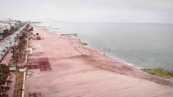 Turkey coastline on spring cloudy day, preparing sandy beach for summer season