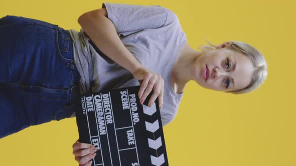 Bored Woman Clapping Clapperboard