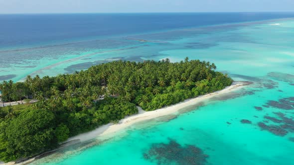 Luxury above clean view of a paradise sunny white sand beach and blue ocean background in 4K