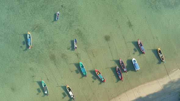 Amazing aerial Top view Longtail fishing boats in the tropical sea at Rawai beach Phuket Thailand