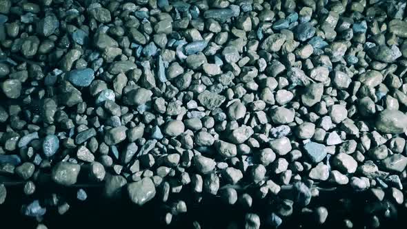 Top View of Copper Ore Falling From the Conveyor in Slow Motion