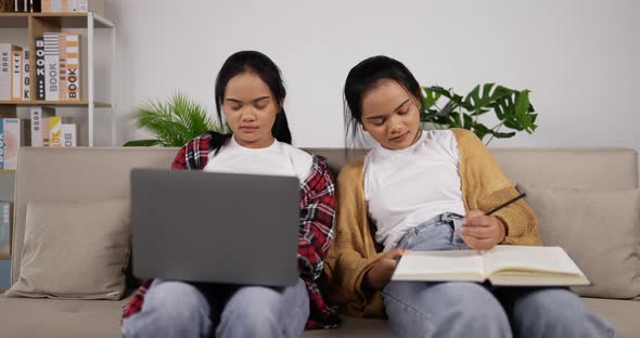 Twin girls learning online and sleeping