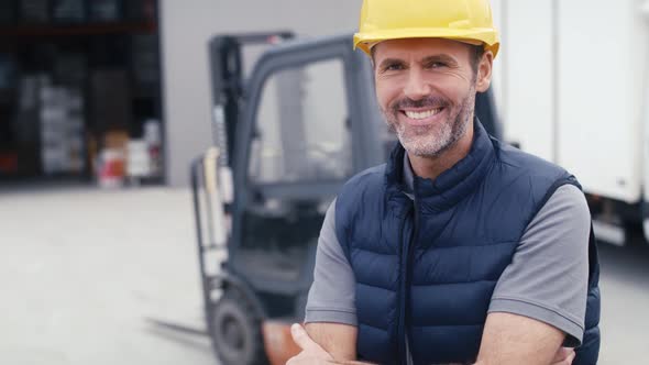 Portrait of caucasian mature man in front of warehouse. Shot with RED helium camera in 8K.