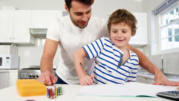 Father helping son with homework