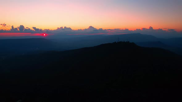 4K Aerial drone of Epic mountain with a colorful sunset