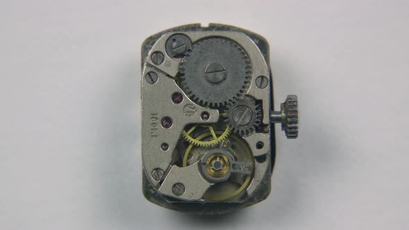 Working Mechanism of Old Mechanical Watch on White Background