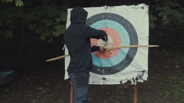 Man happy with arrow in target