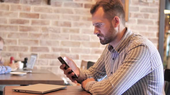 Beard Man Using Smartphone Text Messaging