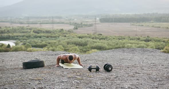 Front View of Handsome Confident Sporty Strong Shirtless Man Which Doing Push-ups with Jumps on the