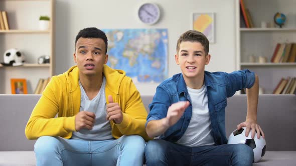 Anxious Teenagers Watching Football Match on TV Unhappy With Team Losing, Sport