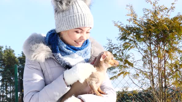 Woman with Little Dog Outdoor, Cold Day