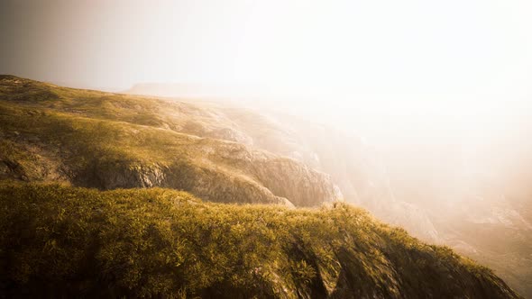 Dry Yellow Grass on the Rocky Mountain with Heavy Fog