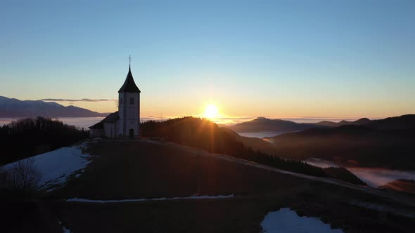 Church of St. Primoz and Felicijan at Sunrise. Julian Alps. Jamnik, Slovenia