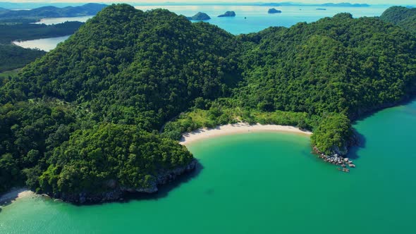 An aerial view of the coast, mountains with many beautiful islands