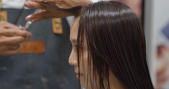 Woman with hair treatment in salon